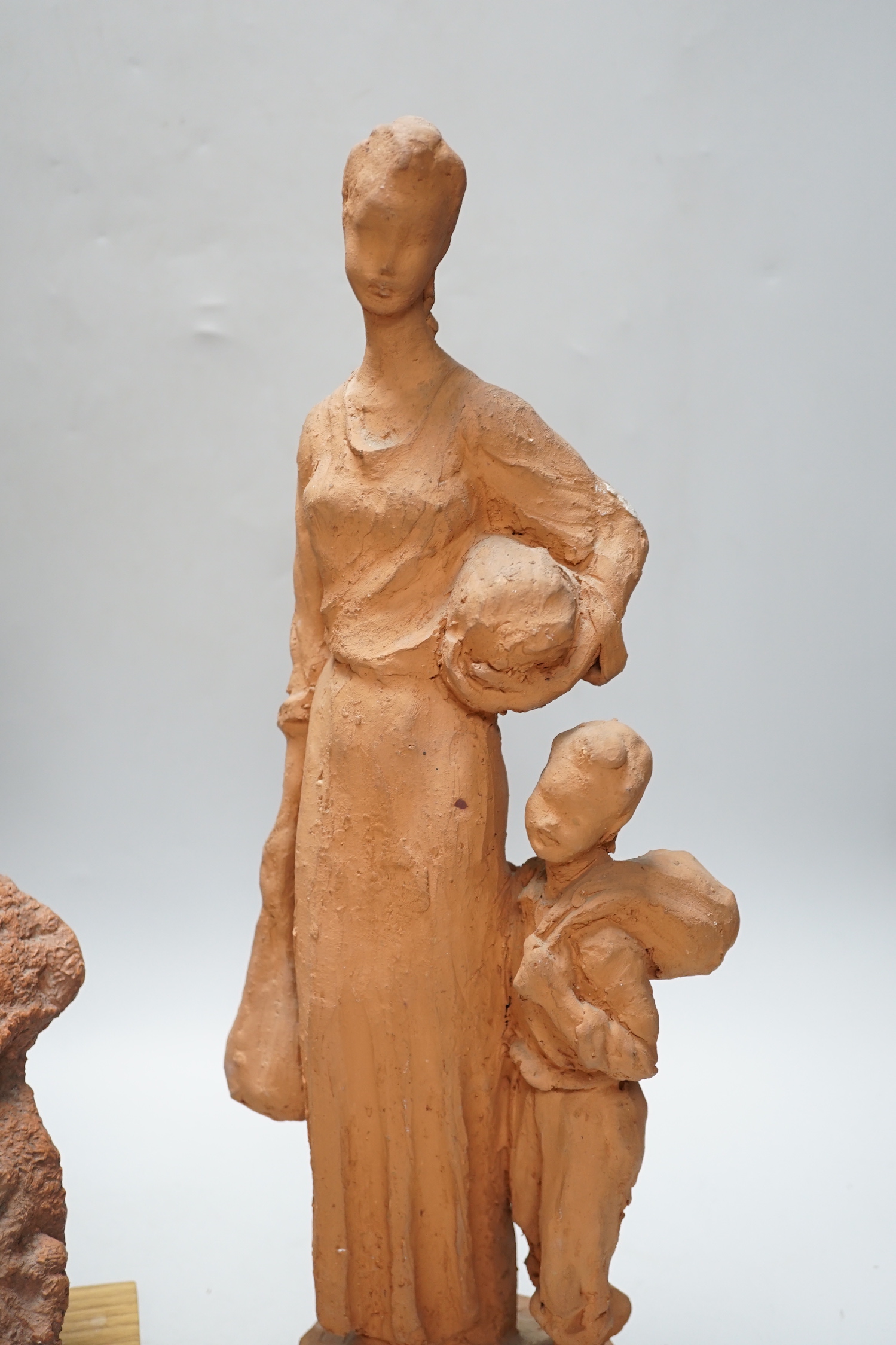 Marcus Cornish (1964-) - ‘’Refugee’’, a terracotta sculpture and one other terracotta sculpture of a mother and child, indistinctly signed, the largest 46cm high (2)